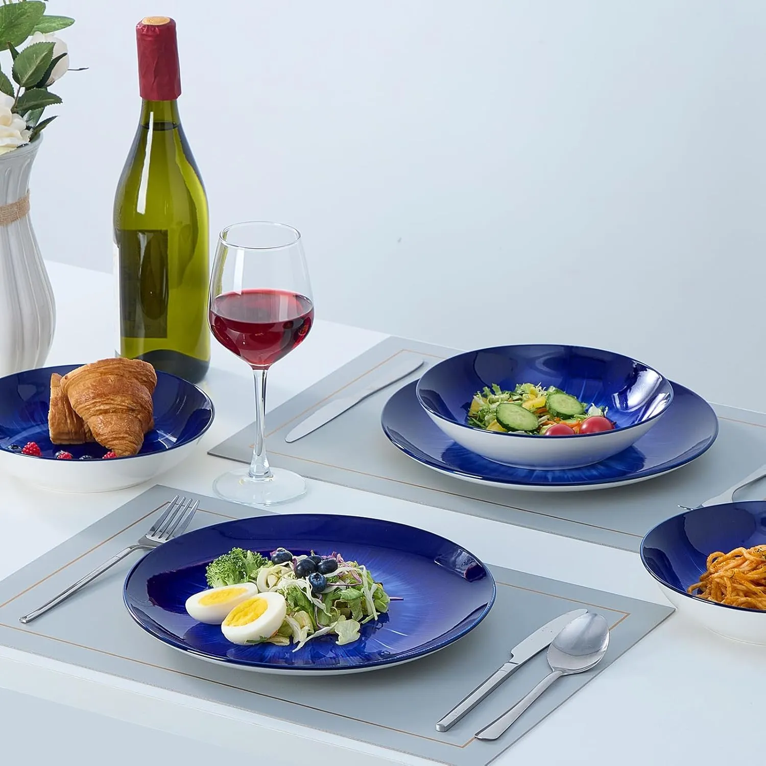 Bestone 12 Piece Round Kitchen Dinnerware Sets,Plates and Bowls sets,Dishes, Plates, Bowls, Dish Set，Plates and Bowls,Service for 4, Chip Resistant Porcelain ，Starburst Turquoise Dark Blue