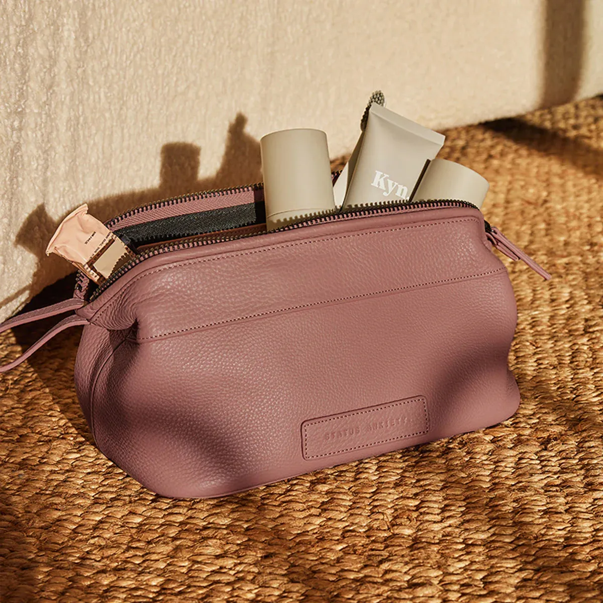 Status Anxiety leather toiletry bag dusty rose large